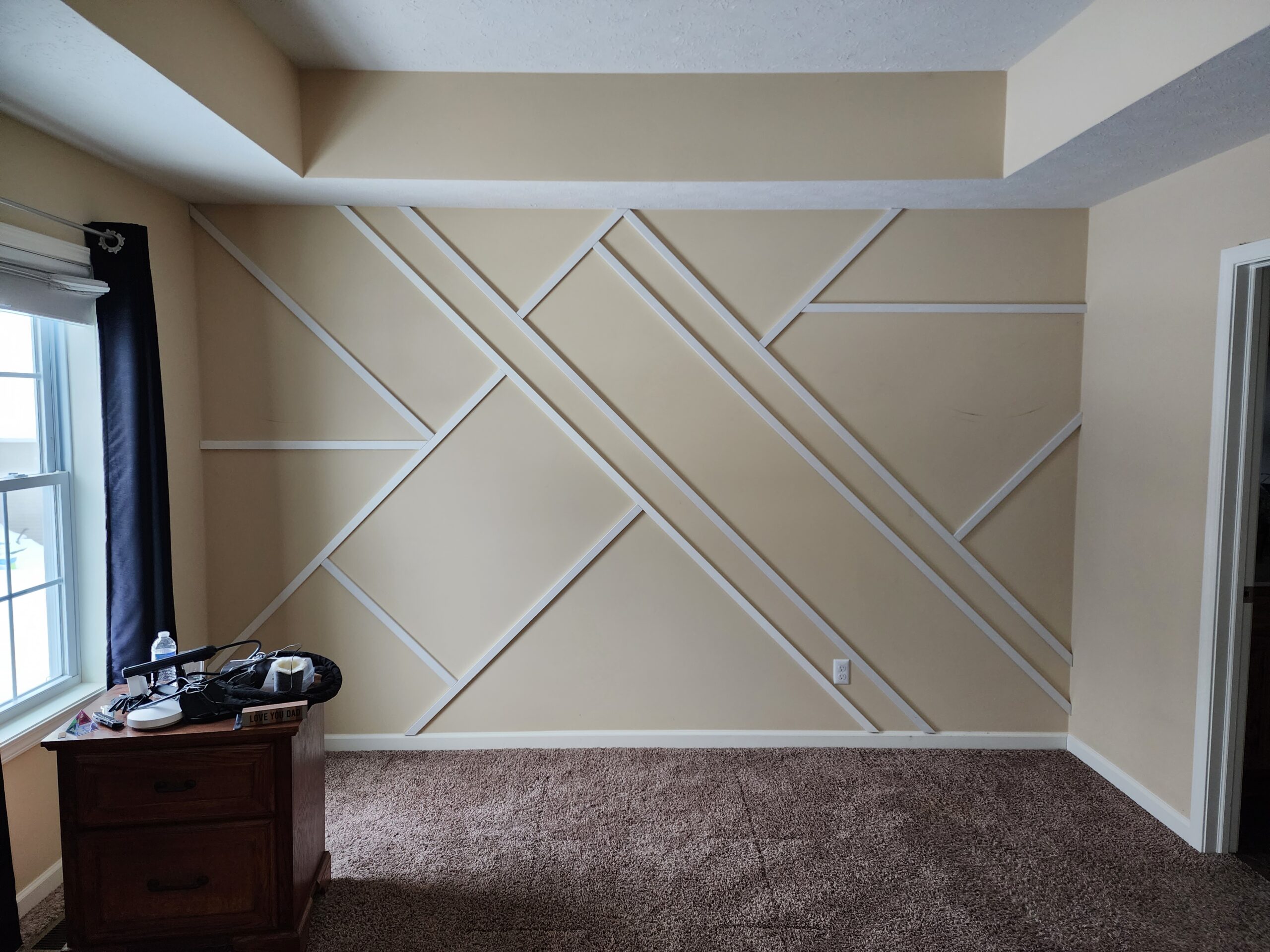 1x2 MDF boards cut and laid out on the wall