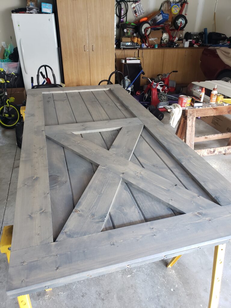 Sliding barn door completely assembled, stained, and ready for hardware