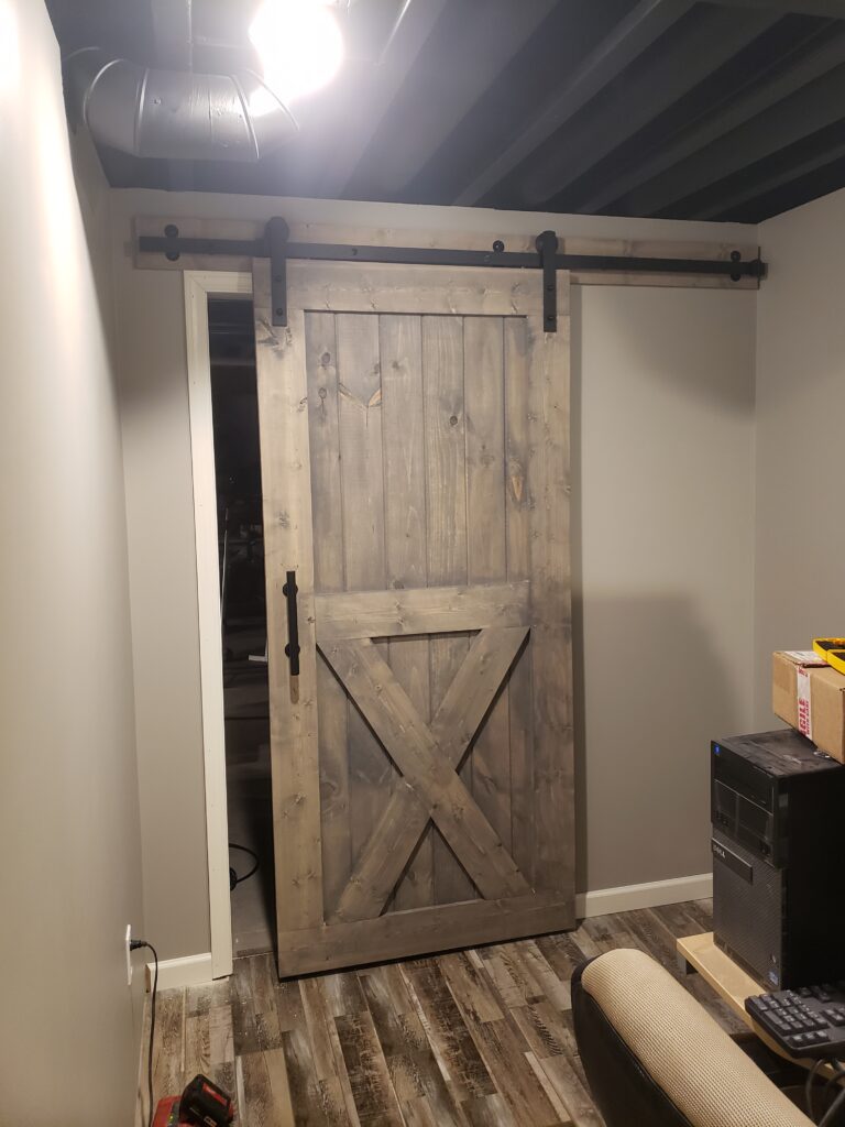 single sliding bard door closed with door stops adjusted