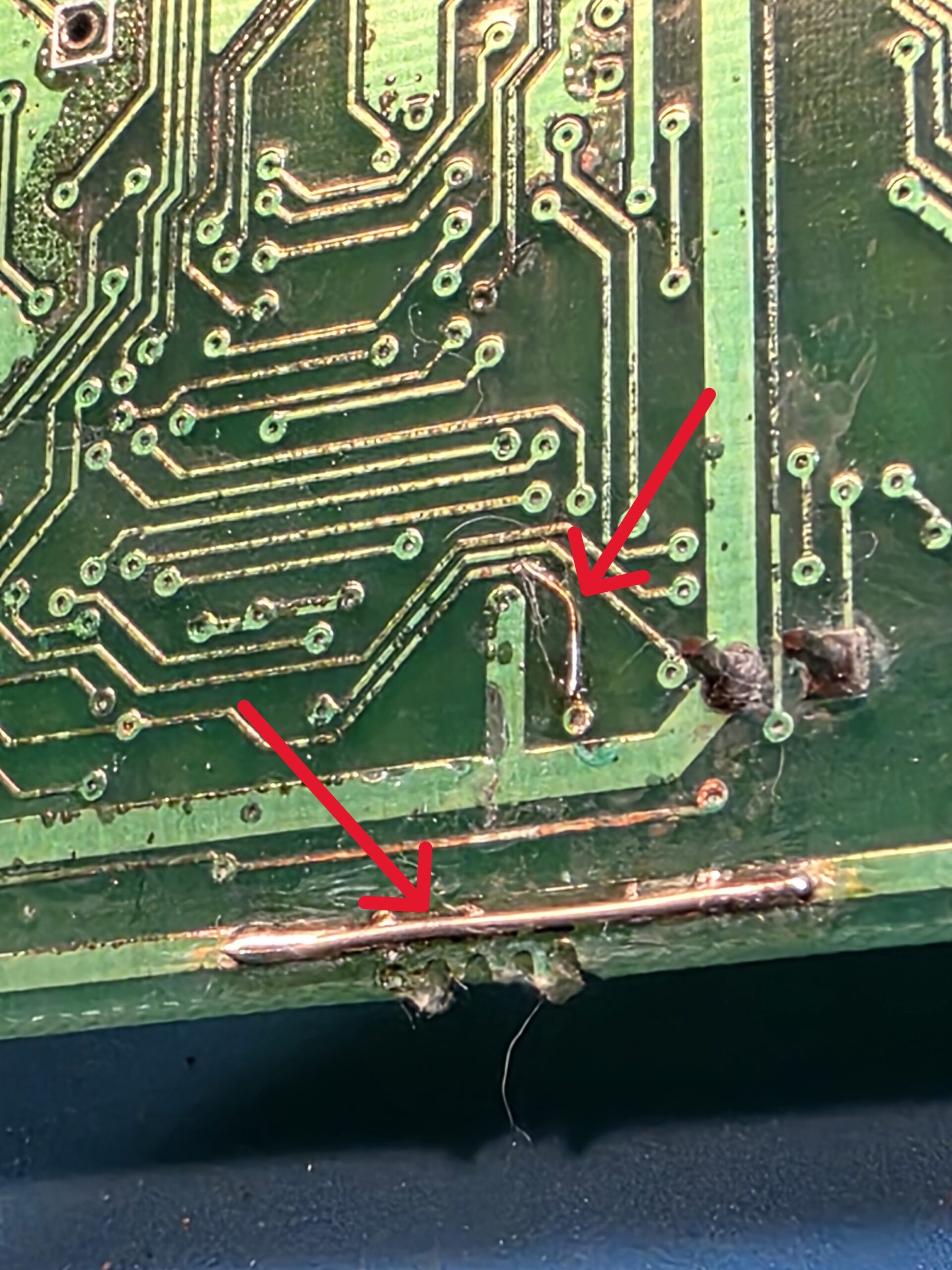 PCB trace repair using copper wire jumper